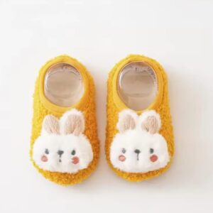 Yellow bunny shoes for kids with playful bunny ears.
