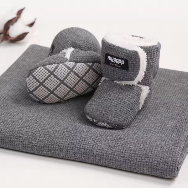 Cozy baby booties with plush lining in soft pastel colors.